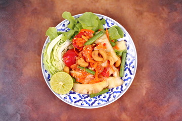 Spicy and sour vegetable salad with pineapple .