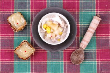 Nian gao dumplings and taro in coconut cream.
