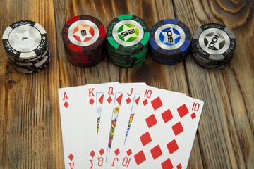 Combination of card game poker on the old wooden table