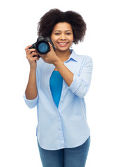 happy afro american woman with digital camera