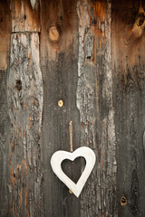 White heart on rustic wooden background