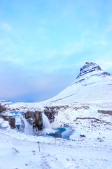 Fototapeta na wymiar Kirkjufell Rock in the Winter oft Iceland Frozen Waterfall