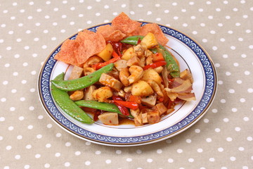 Fried mixed fruit and vegetable with roasted chili plate .