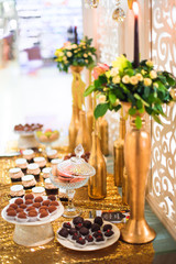 golden candy bar with truffle candies