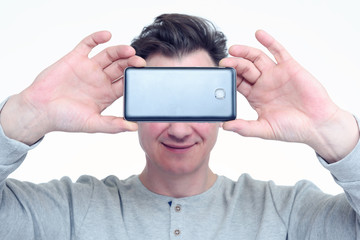 Happy man photographed by smartphone