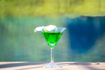 Tasty cocktail background swimming pool, greenery tone