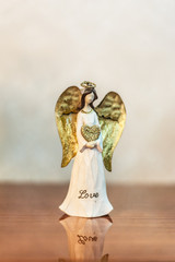 Small angel statuette with love inscription