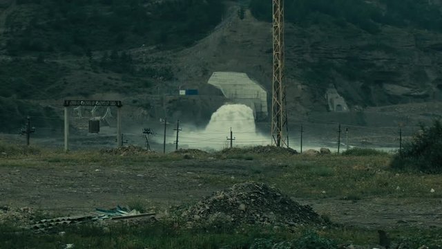 Rapid flow of water. HPP spillway. Emergency water discharge.