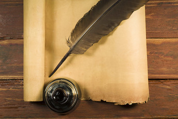 Dark pen with inkwell on papyrus