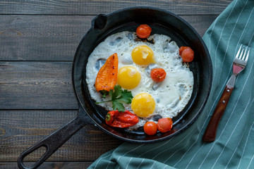 Fried eggs sunny side up in a frying pan