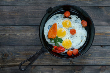 Fried eggs sunny side up in a frying pan