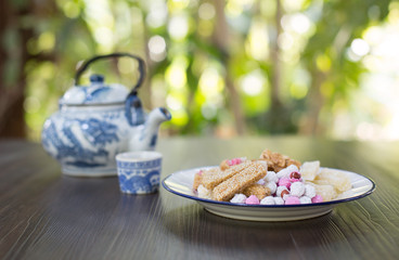 Chinese snacks sweet dessert in dish and Chinese tea