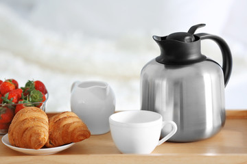 Breakfast in bed. Tray with strawberries, croissants and coffee