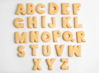 Zelfklevend Fotobehang Cookie alphabet on white background © Africa Studio