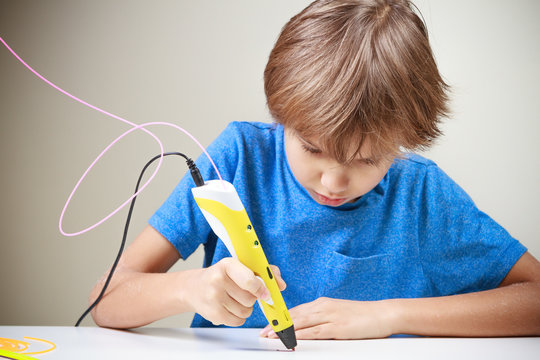 Child using 3D printing pen. Boy making new item. Creative, technology, leisure, education concept