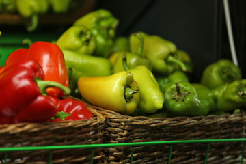 Fresh vegetables in wicker boxes on market