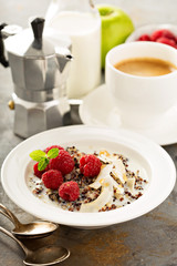Quinoa porridge with raspberry and coconut flakes