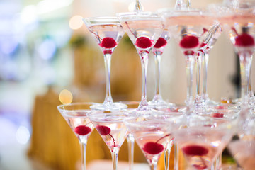 a pyramid of glasses with champagne