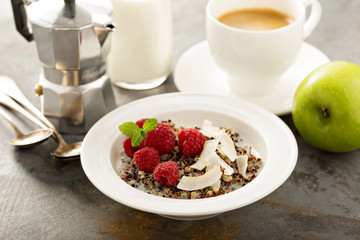 Quinoa porridge with raspberry and coconut flakes