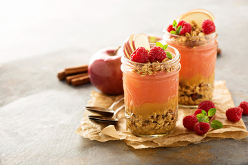 Applesauce and raspberry puree parfait with granola