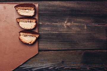Obraz na płótnie Canvas chocolate bar and biscuit biscuits broken into slices