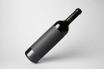 Slanted bottle on gray background