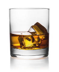 Round transparent glass of whiskey with ice