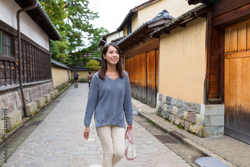 Poster woman walking in kanazawa city