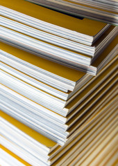 Stack of yellow monthly magazine