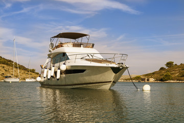 Fototapeta premium Yacht in the sea in small harbour.