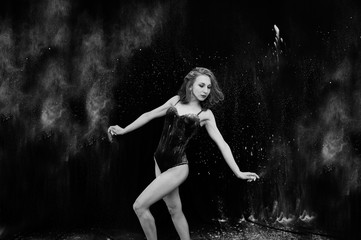 Girl dancer jumping and dancing in the white dust with flour on © AS Photo Family