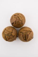 Tasty chocolate muffins on the white background