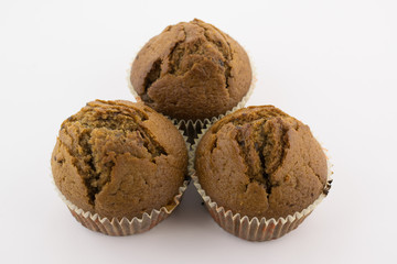 Tasty chocolate muffins on the white background