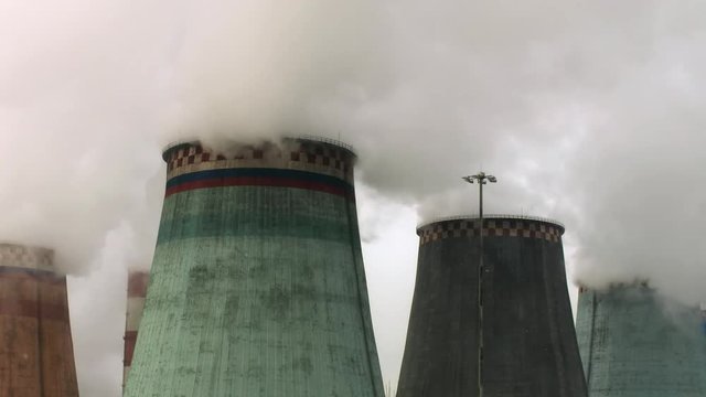 steam coming out of the cooling towers of thermal power plants
