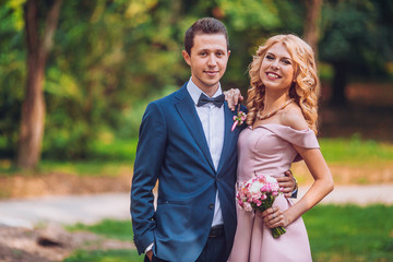 happy groomsman and bridesmaid 