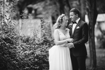 Bride and Groom walking away from the camera after their wedding. Cuouple dancing and swirl