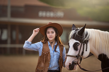 Obraz premium Cowgirl with Horse
