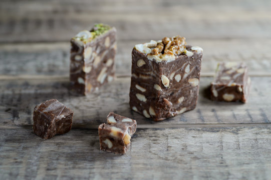 walnut halvah, halava sweet desert on a rustic wooden table