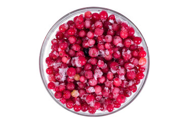 Plate frozen red currants on a white background. Harvesting of berries for the winter.