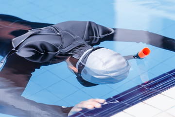 Free diving training on swimming pool