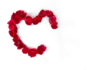 A heart shape made of petals on white background for greeting card template
