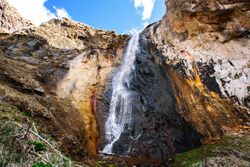 Fototapeta na wymiar large waterfall in the mountains