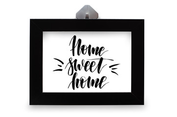 Home sweet home. Handwritten text. Modern calligraphy. Black photo frame.