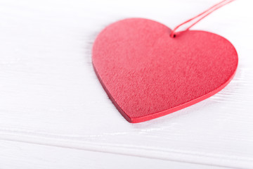 Heart on white wooden table