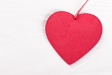 Heart on white wooden table