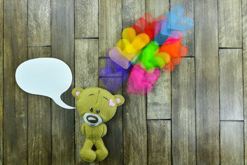 Fototapeta premium Valentines Day postcard. Teddy Bear and colourful hearts
