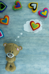 Valentines Day postcard. Teddy Bear and colourful hearts