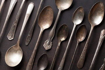 Old vintage spoons on stone table