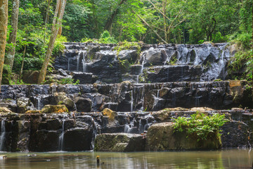 Fototapeta na wymiar Beatiful of waterfall in national green forest background