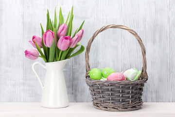 Easter eggs and pink tulips bouquet